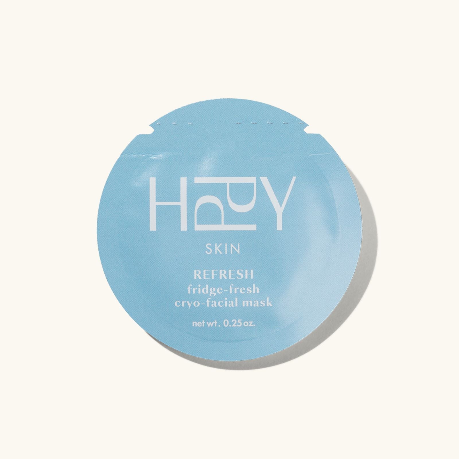 Blue facial mask packaging with 'HPPY Skin' branding on a white background