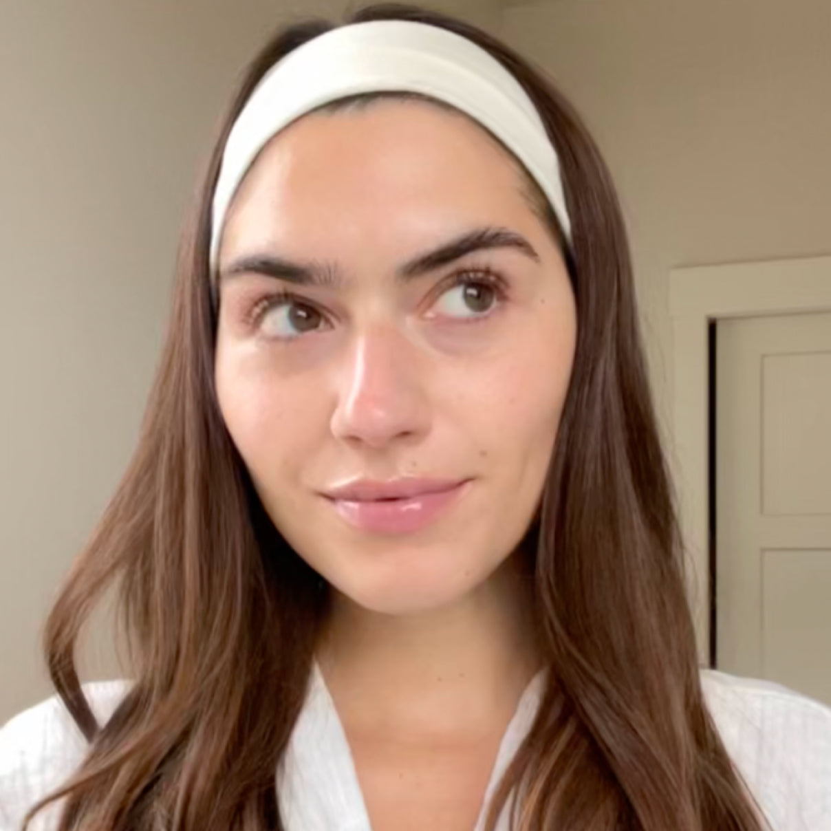 Woman wearing a white headband indoors