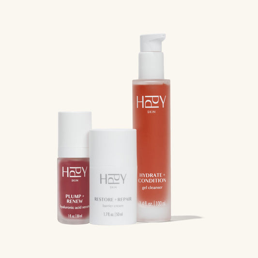 Three hppy skincare products on a white background