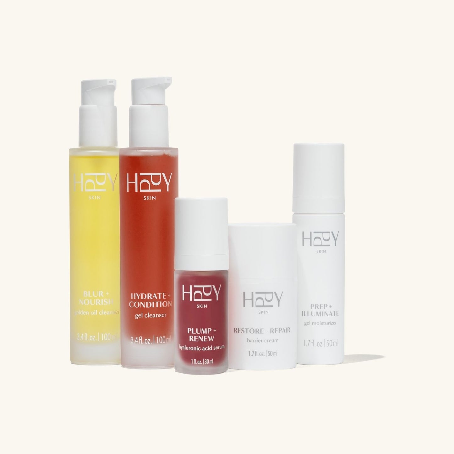 Set of hppy skincare products on a white background