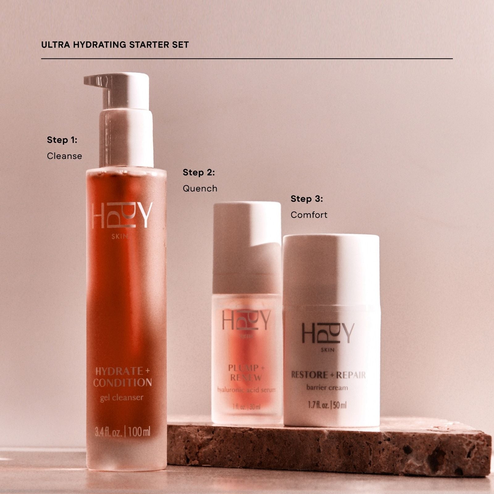 HPPY® skincare starter set with three products on a neutral background