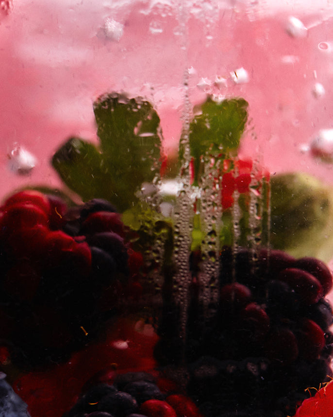 Close-up of a berries with a pinkish-red background