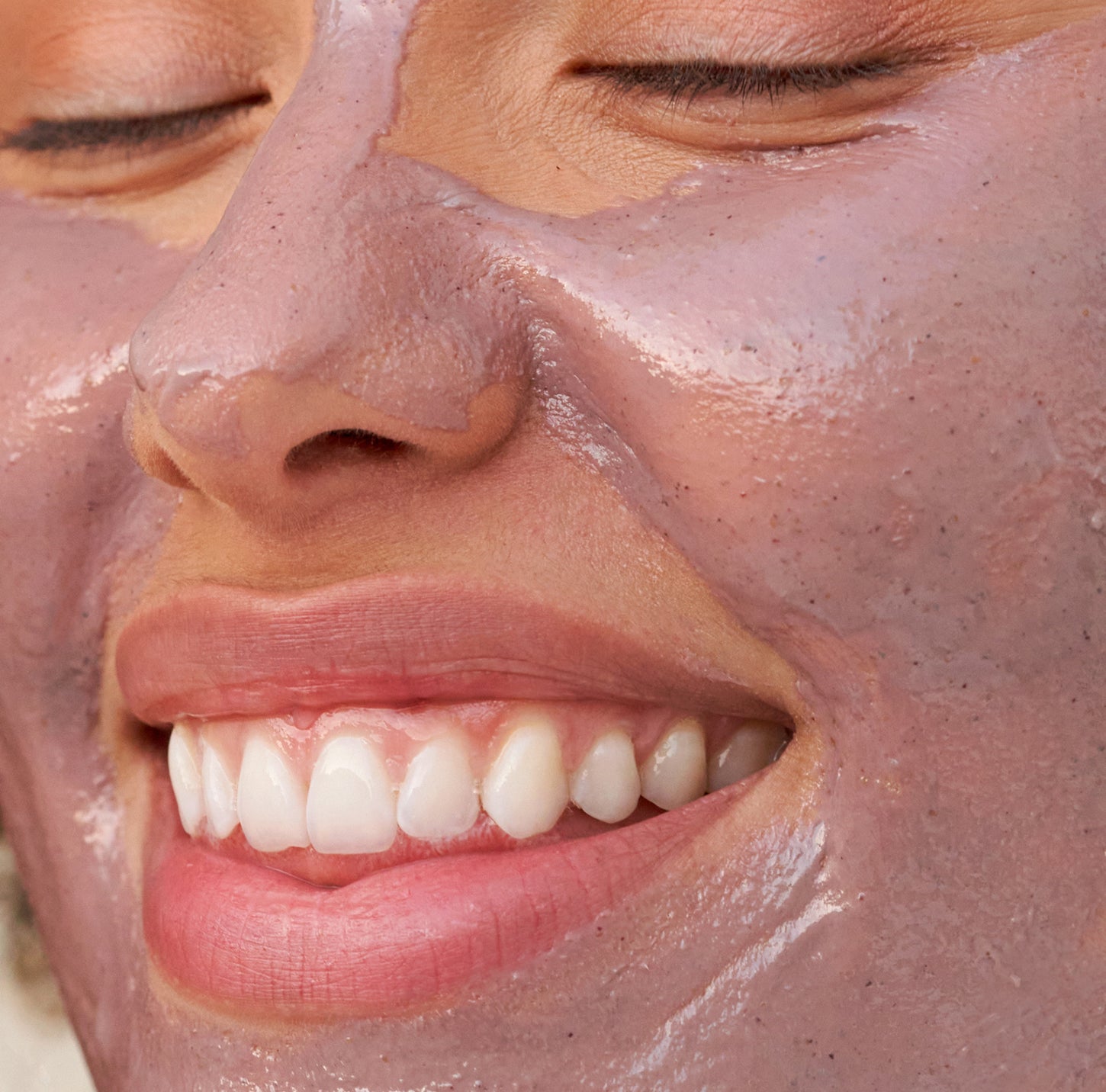Close-up of a person with a clay mask on their face