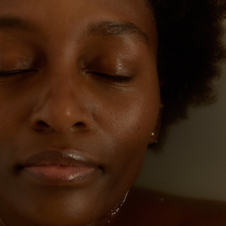 Close-up of a person with eyes closed, possibly in a moment of relaxation or sleep.